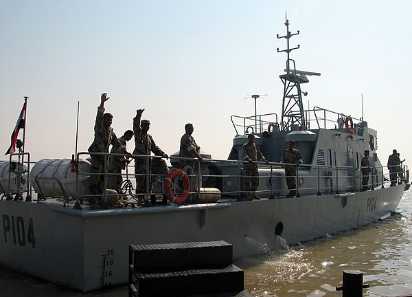 Umm Qasr, Iraq (30 Sept. 2004), Iraqi sailors celebrate as they get underway for the first time.