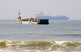 US Navy 110304-N-1786N-063 A causeway ferry makes its approach to the beach after receiving vehicles from the Military Sealift Command container ro.jpg