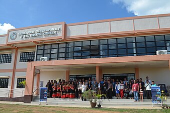 Group picture with participants and guest speakers at the front of the Research, Development and Extension Center of Agusan Del Sur State College of Agriculture and Technology