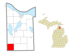 Location within Cheboygan County (red) and an administered portion of the village of Wolverine (pink)