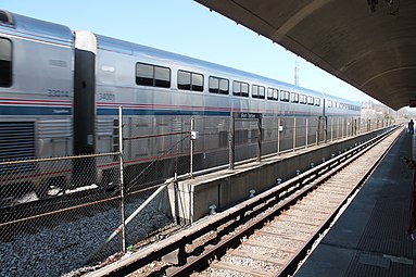 Silver railcars with many windows