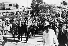 A 1922 Anzac Day parade led by a flag bearer with the Union Jack ANZAC Day at Manly, 1922.jpg