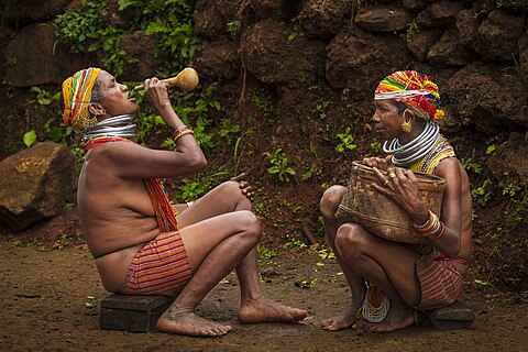 A Bonda tribal woman of Odisha drinking Mahua drink