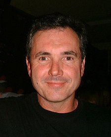 Alan Fletcher plays Rhys' colleague and "career rival", Karl Kennedy. Alan Fletcher 2001.jpg