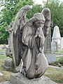 An angel sculpture on a grave to the south of St Nicholas' Church, Chislehurst.