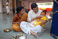 Image 9Samskaras are, in one context, the diverse rites of passage of a human being from conception to cremation, signifying milestones in an individual's journey of life in Hinduism. Above is annaprashan samskara celebrating a baby's first taste of solid food. (from Samskara (rite of passage))