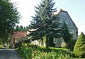 Half-timbered barn of a three-sided courtyard