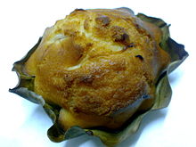 Bakery-made bibingka in banana leaf liner showing the distinctive notched edges from cupcake tin molds