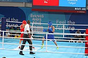 Deutsch: Boxen bei den Olympischen Jugendspielen 2018 Tag 12, 18. Oktober 2018 - Finale im Leichten Weltergewicht Jungen – Ilia Popov (Russland, rot) schlägt Talgat Shaiken (Kasachstan, blau) 4-1; Ringrichter ist James Beckles (Trinidad und Tobago). English: Boxing at the 2018 Summer Youth Olympics on 18 October 2018 – Final Light Welterweight Boys Bout - Ilia Popov (Rusia, rojo) supera a Talgat Shaiken (Kazajstán, azul) 4-1; Referee is James Beckles (Trinidad and Tobago). Español: Boxeo en los Juegos Olímpicos Juveniles de Verano de 2018 en 18 de octubre de 2018 - Chicos de peso welter ligero final: Ilia Popov (Uzbekistán, roja) le gana a Talgat Shaiken (Egipto, azul) 4-1; El árbitro es James Beckles (Trinidad y Tobago).