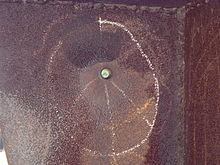 The bullet hole through Solar Totem #1 Bullet Hole in Don Drumm Sculpture at Kent State.JPG