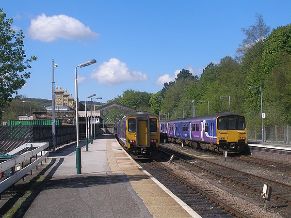 Two Northern services awaiting their respective departures towards Manchester.