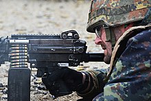 M27 links connect up to 200 5.56x45m NATO rounds (4 x M855 ball : 1 M856 tracer) contained in an ammunition box used to feed a M249 light machine gun CATC trains German soldiers on US weapons 151209-A-HE539-0429.jpg