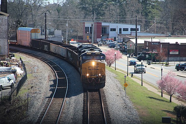 A CSX train passing through downtown Acworth