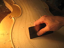 Leveling cello arching with card scraper Card scraper - making violin.jpg