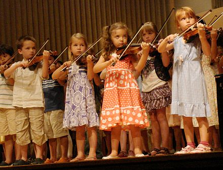Children playing the violin in a group recital, Ithaca, New York, 2011