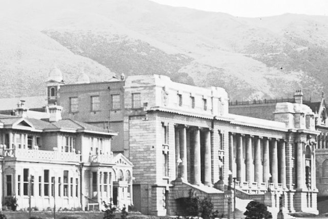 Parliament House in 1929, shortly after completion. The building to the left is Government House.
