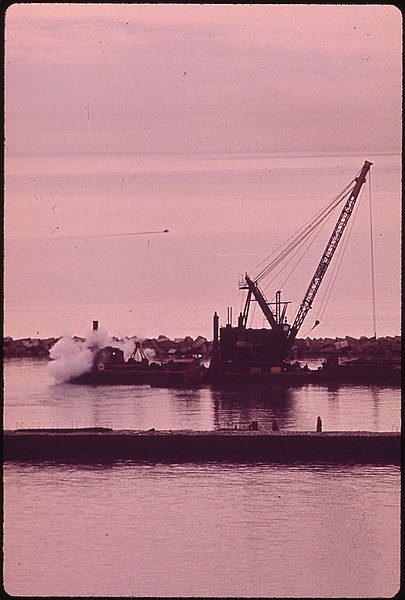 File:DREDGE BARGE AT WORK INSIDE BREAKWATER OF CONSUMER POWER PLANT AT LUDINGTON - NARA - 547113.jpg