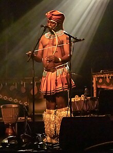 Dizu Plaatjies performing in Helsinki, November 2018. Dizu Plaatjies & The Ibuyambo Ensemble (45038895904).jpg