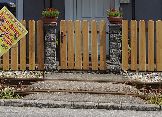 Two flower boxes, two gateposts, and two rails