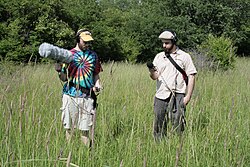 Two individuals recording ecoacoustics in the field. Ecoacoustics recording in Rural Illinois, USA.jpg