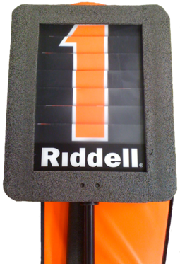 A modern down indicator box is mounted on a pole and is used to mark the current line of scrimmage. The number on the marker is changed using a dial. First down marker.png