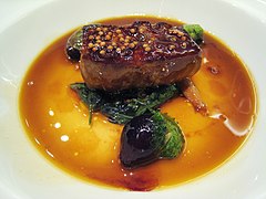 Foie gras with mustard seeds and green onions in duck jus