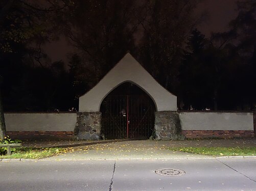 Nightly view of cemetery gate