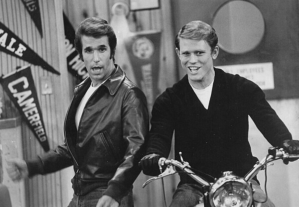 Richie (Ron Howard) takes a turn on Fonzie's (Henry Winkler) motorcycle in a scene from Happy Days