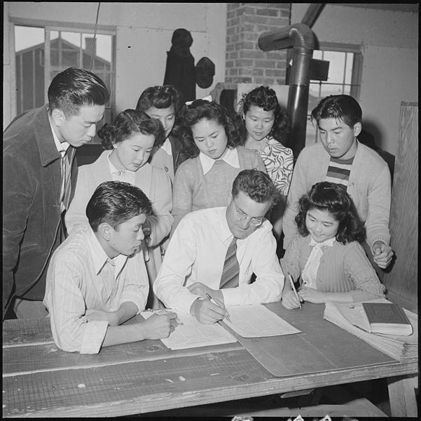 File:Heart Mountain Relocation Center, Heart Mountain, Wyoming. A part of the Echoes staff gathers f . . . - NARA - 537155.jpg