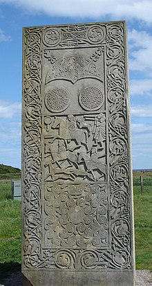 The landward-facing, secular side of the cross-slab on location in Easter Ross. This is the reconstruction by Barry Grove. HiltonofCadboll01.JPG