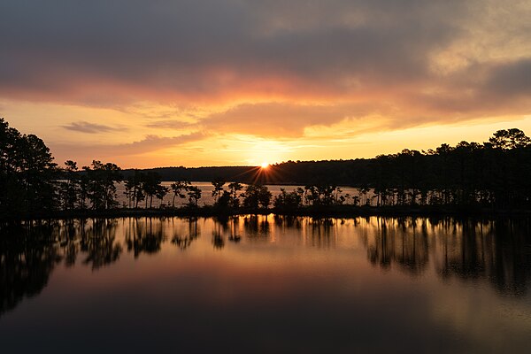 The sun rising over Jordan Lake, taken from Farrington Road