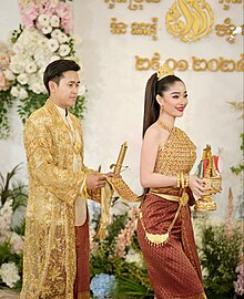 A groom clings the Sbai of a groom, which is the symbolic of Preah Thong Taong Sbai Neang Neak Khmer wedding.jpg