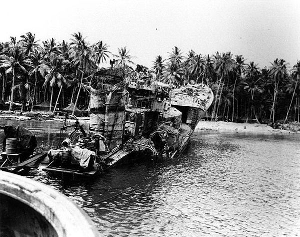 The rusting hulk of Kikuzuki, photographed on Tulagi in August 1943 after U.S. forces dragged the wreckage onto the beach