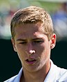 Kimmer Coppejans competing in the first round of the 2015 Wimbledon Qualifying Tournament at the Bank of England Sports Grounds in Roehampton, England. The winners of three rounds of competition qualify for the main draw of Wimbledon the following week.