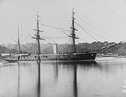 Three-masted armoured warship.