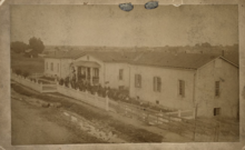 Original location in Las Vegas, New Mexico, c. 1880 Las Vegas College (later Regis University), c. 1880.png