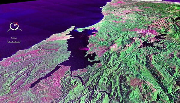 False colour Landsat image centred on Macquarie Harbour, looking northwest, draped over digital elevation model with x2 vertical exaggeration; screen 