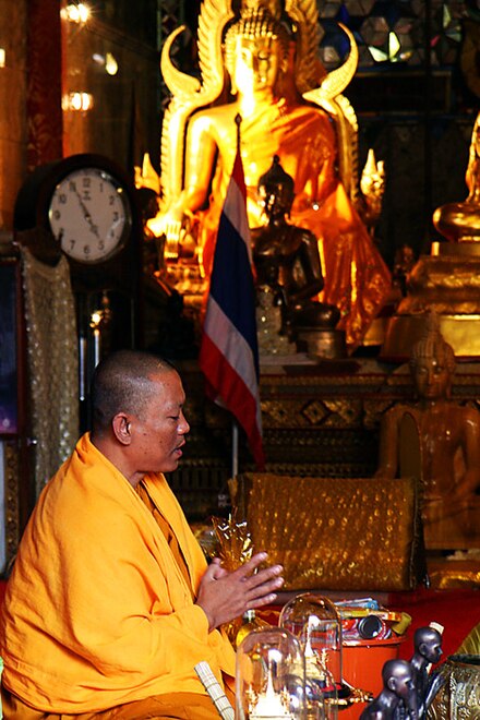 A Buddhist monk reciting prayers in Thailand.