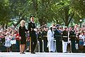 Nancy Reagan receives applause while watching the President's body being transfered to a caisson