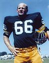 A photo of Ray Nitschke holding his helmet