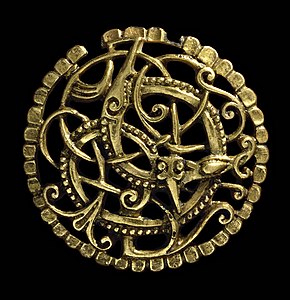 Gilt copper-alloy disc brooch with exquisite ornamentation from Pitney, Somerset, South West England. 1000–1100.