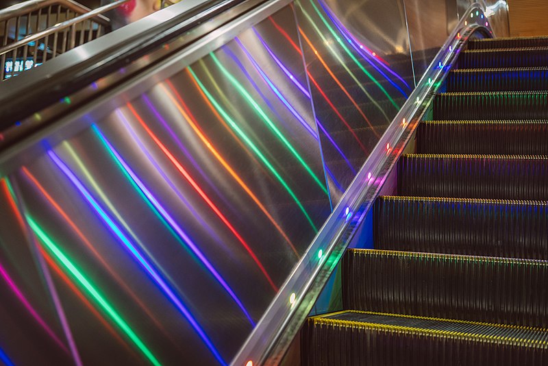 File:Rainbow escalator lighting at Castro station, December 2018.jpg
