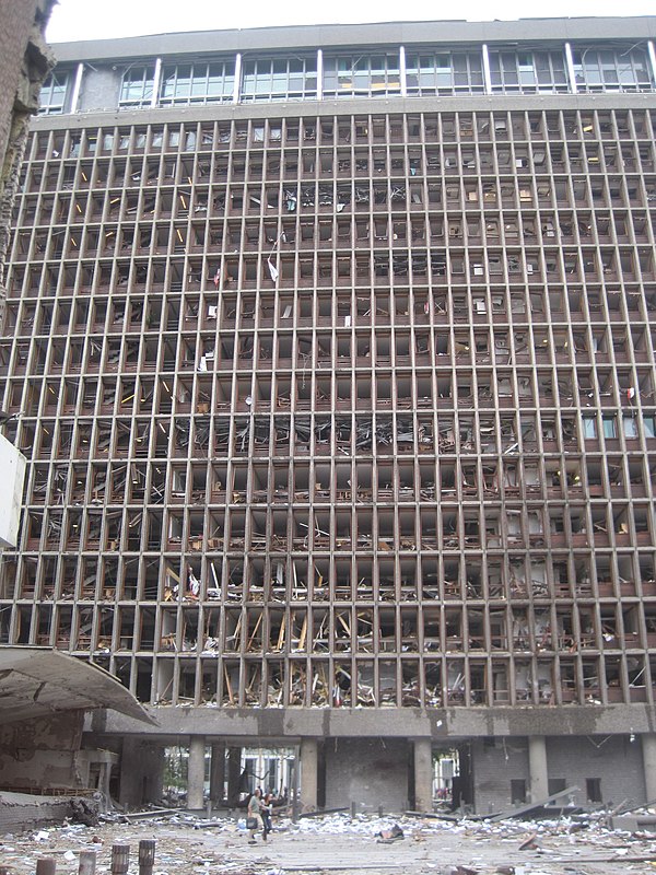 The building housing the Office of the Prime Minister and Ministry of Justice and the Police with blown-out windows shortly after the explosion. The b