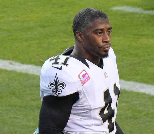 A stunned New Orleans Saints' Roman Harper walks off the field as