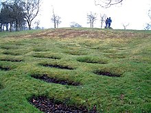 Lilia in front of Rough Castle on the Antonine Wall in central Scotland. Rough Castle Fort.jpg