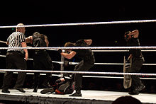 The Shield performing a beat down on Kane The Shield Teamwork.jpg