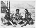 Three hula dancers with ukulele. Lizzie Puahi in center (PP-32-9a-017).jpg