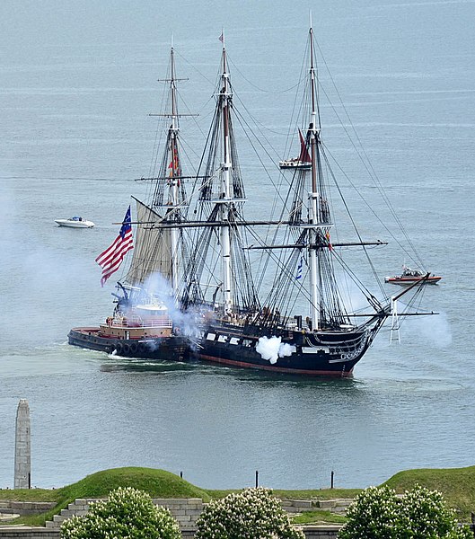 Constitution fires her cannons as she is tugged through Boston Harbor in 2021.