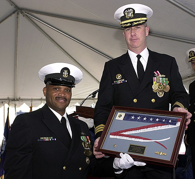 File:US Navy 030110-N-8837H-024 Command Master Chief Ronnie Moore presents Commander Kevin Sweeney, Commanding Officer, the Commissioning Pennant during his Change of Command.jpg