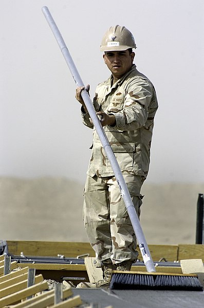 File:US Navy 101022-N-6436W-039 Builder Constructionman Jacob Chavez, assigned to Naval Mobile Construction Battalion (NMCB) 40, places concrete for a p.jpg